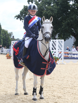 Ellie Burrell-Squibb wins the Stepping Stones 128cm Championship Final